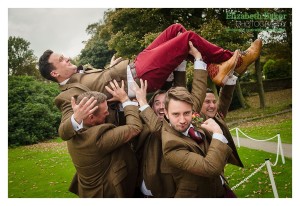 groomsmen lifting the groom funny pic