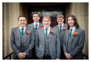 groomsmen outside church orange gerbers