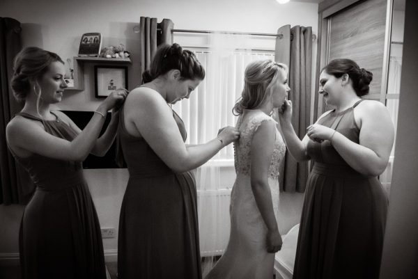 black and white photo of the girls getting ready at 315 restaurant and spa wedding