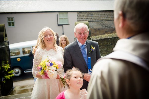 bride and dad with vicar