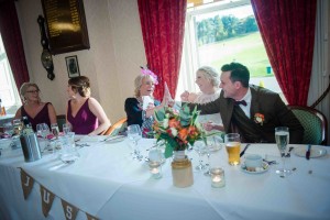 brides mum and groom high five