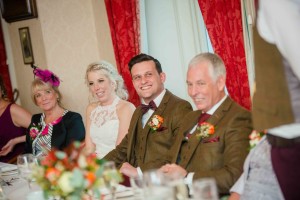 groom laughs during speeches'