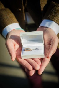 best man holds the rings