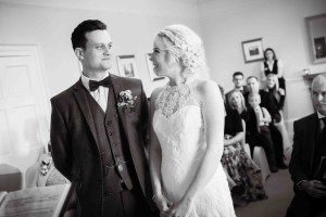 bridal couple looking at each other during ceremony black and white