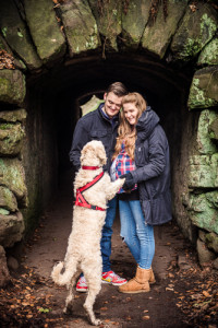 dog jumps up at couple for stroke