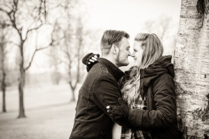 maternity couple cuddle and laugh