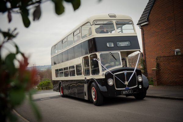 vintage bus arrives with guests