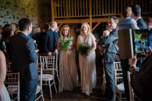 bridesmaid enter the barn