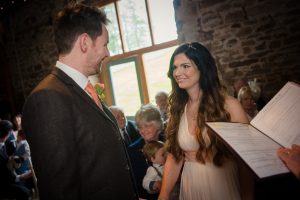 wedding ceremony bride looks at groom