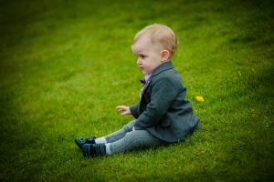little boy poses for dad