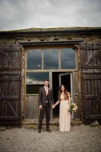 Bride and groom outside the barn portrait
