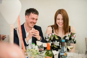 family laughing at speeches