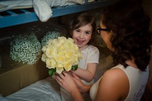 flower girl receives bouquet
