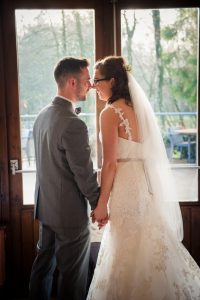 bride and groom walk out as newlyweds