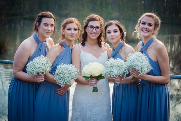 bridesmaids gather for a photo