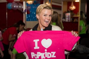 Kerry Katona poses with t-shirt for Popkidz