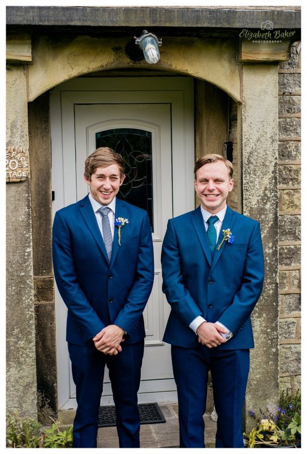 groom and best man outside house