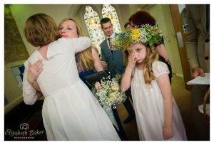 family of groom congratulate after wedding
