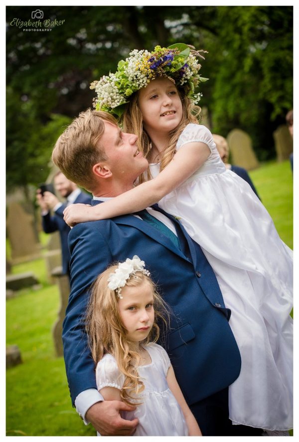 groom picks up his sisters