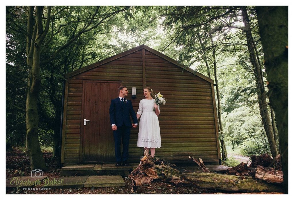 Bride and groom near shed