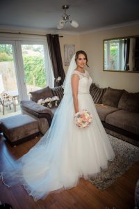 bride looking off camera in wedding dress
