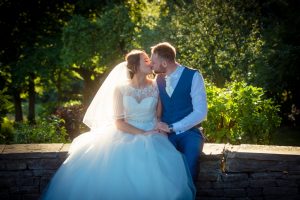 happy couple sitting in beautiful light