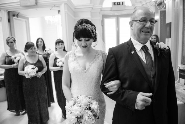 bride waits with dad outside the ceremony