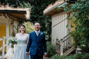 newlyweds walking from outdoor ceremony