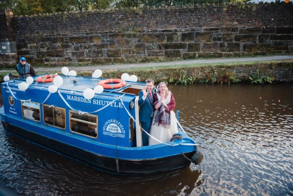canal boat arriving with newlyweds