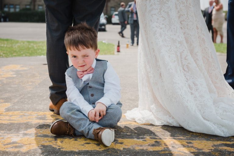 child looking bored at wedding