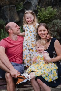 family looking at camera laughing