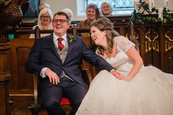 seated image of the bride and groom in Dobcross church