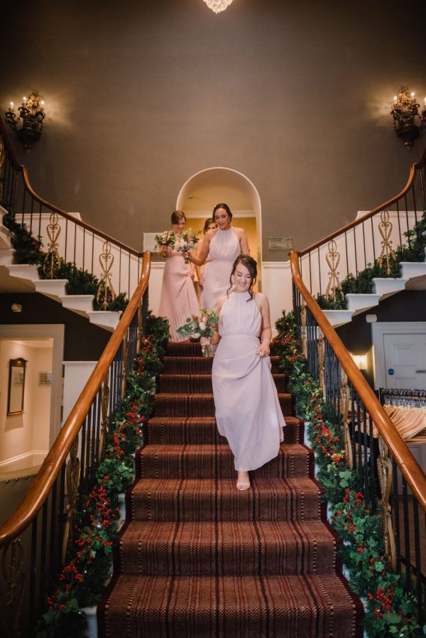 bridesmaids on the amazing staircase
