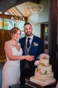 Couple cut the cake at Manor HOuse