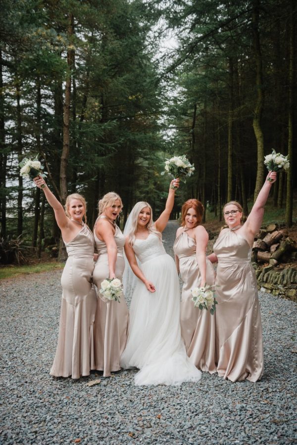 Bridesmaids celebrate with the bride